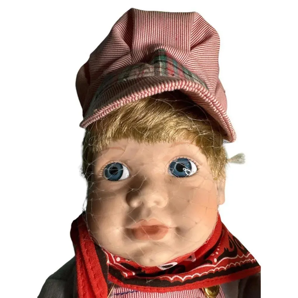 Doll Vintage from the 1990s Materials: Bisque Porcelain, Fabric, Wood About this